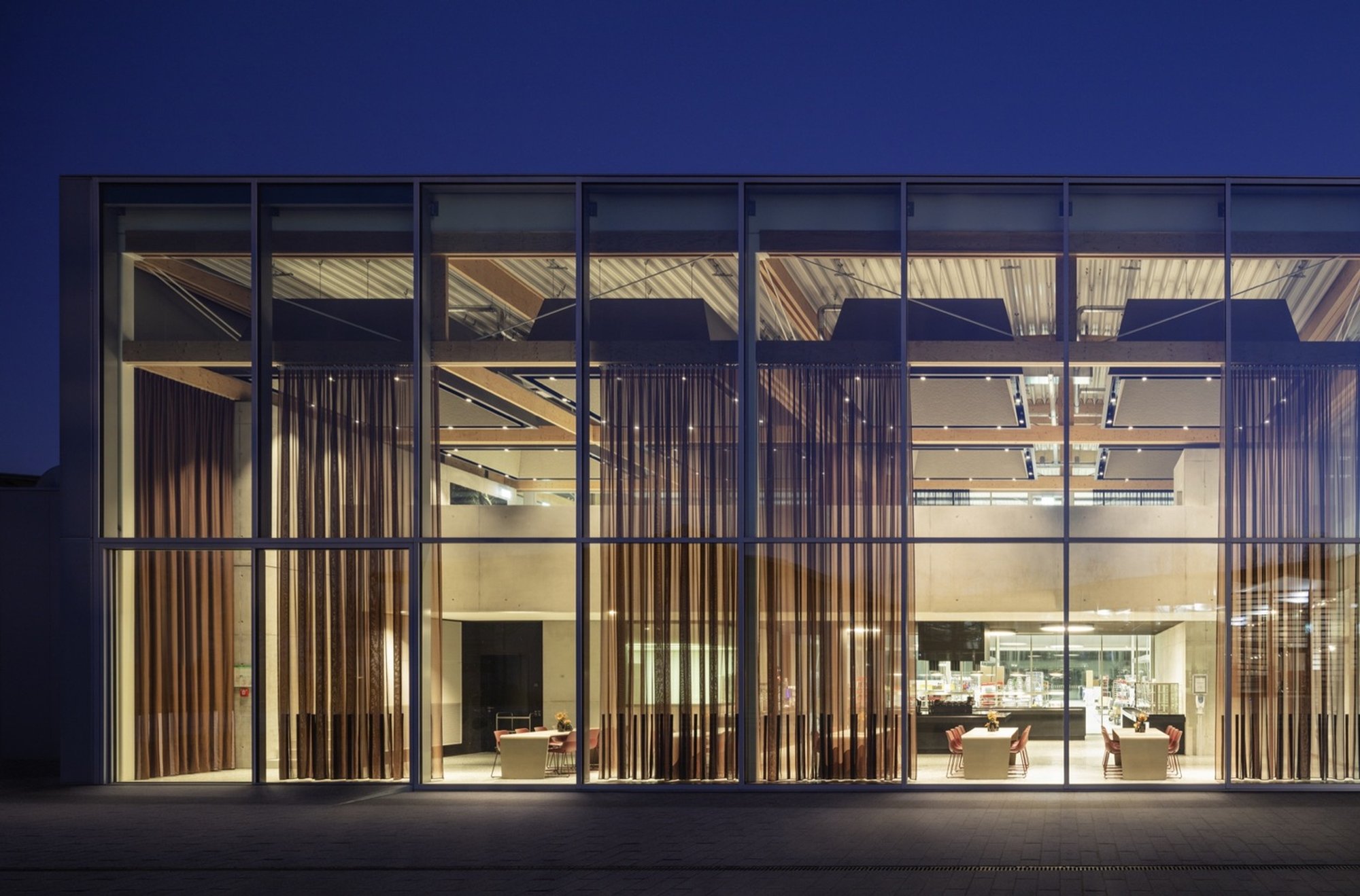 HENN Builds Brunner a Factory Where Office Workers and Production Lines Share One Timber Roof