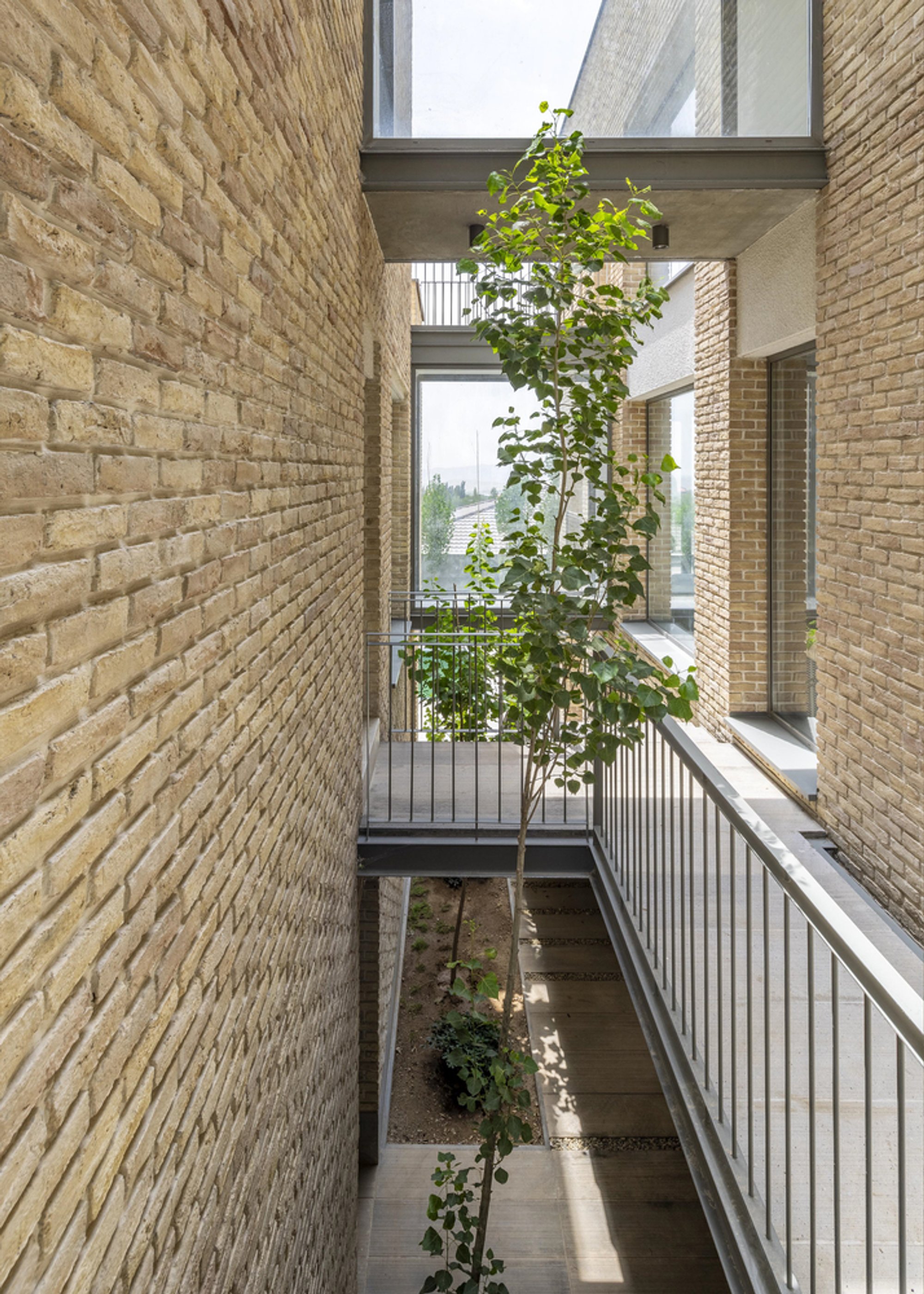 Pargar Architecture Splits a Tehran Home in Two and Bridges the Gap with Glass