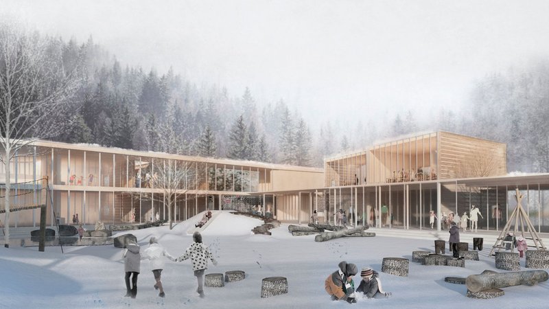 Courtyard view of the timber-framed school wings with children playing on scattered blocks in fresh snow