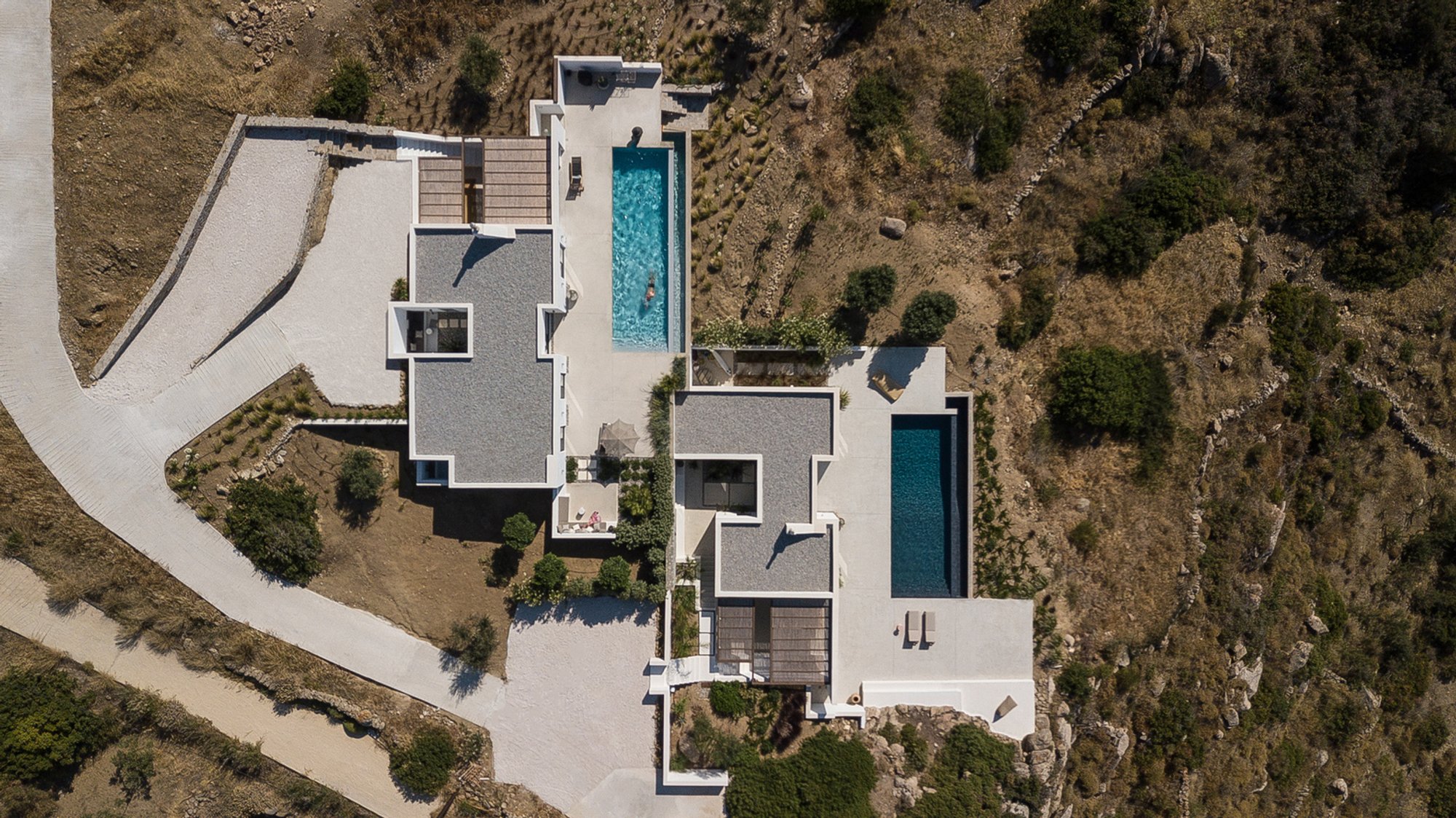 Plinthos Architects Carve Two Vacation Villas into a Naxos Hillside