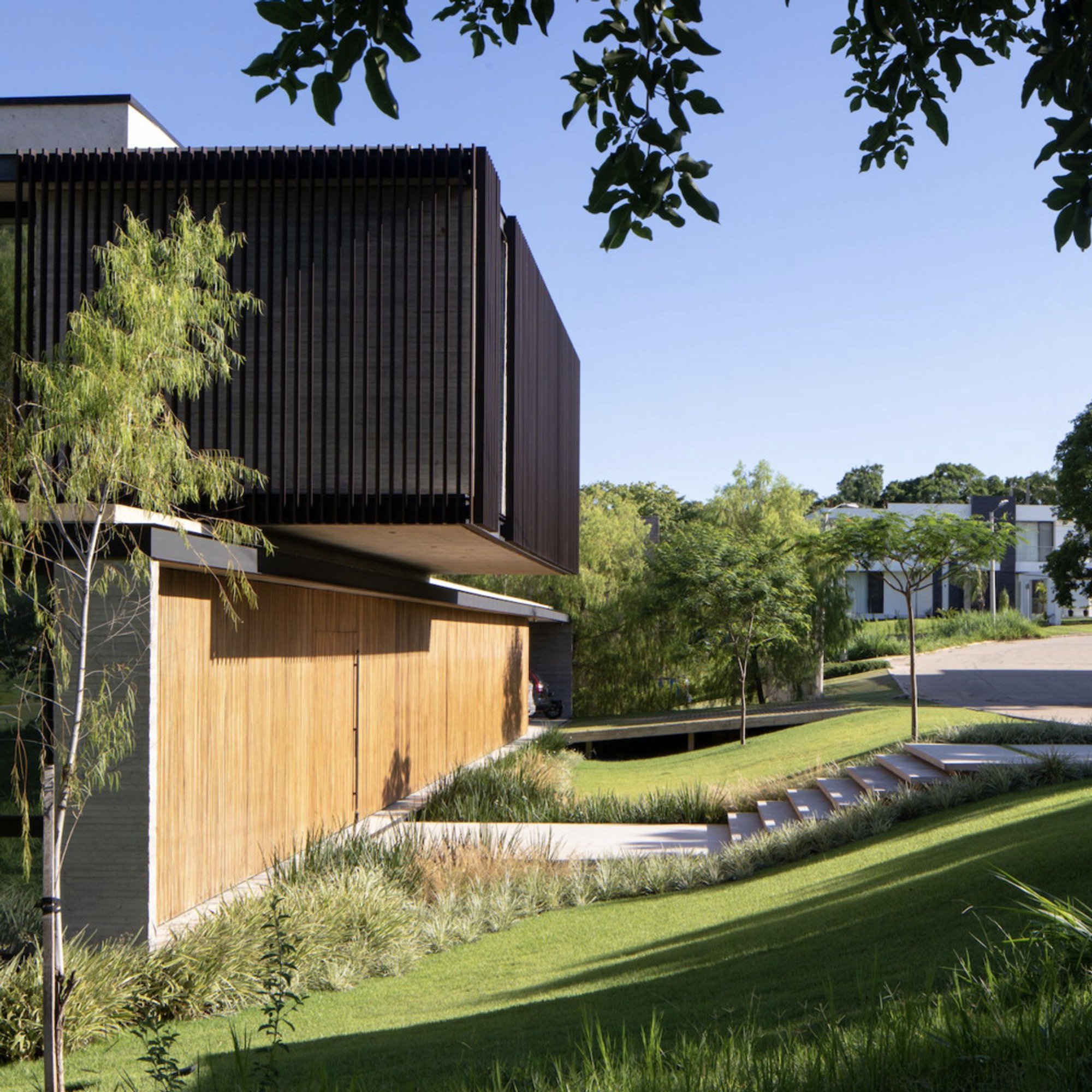 Sommet Frames a Bolivian Golf Course as a Private Garden in the Salatino House