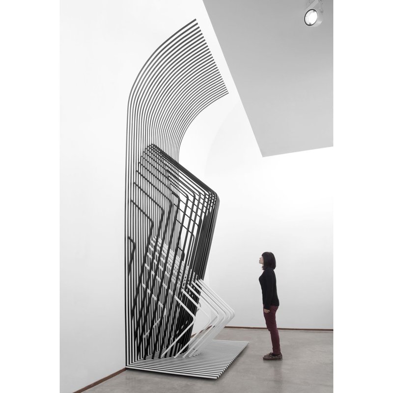 Scaling Dimensions – A visitor experiences the shifting spatial illusion firsthand.