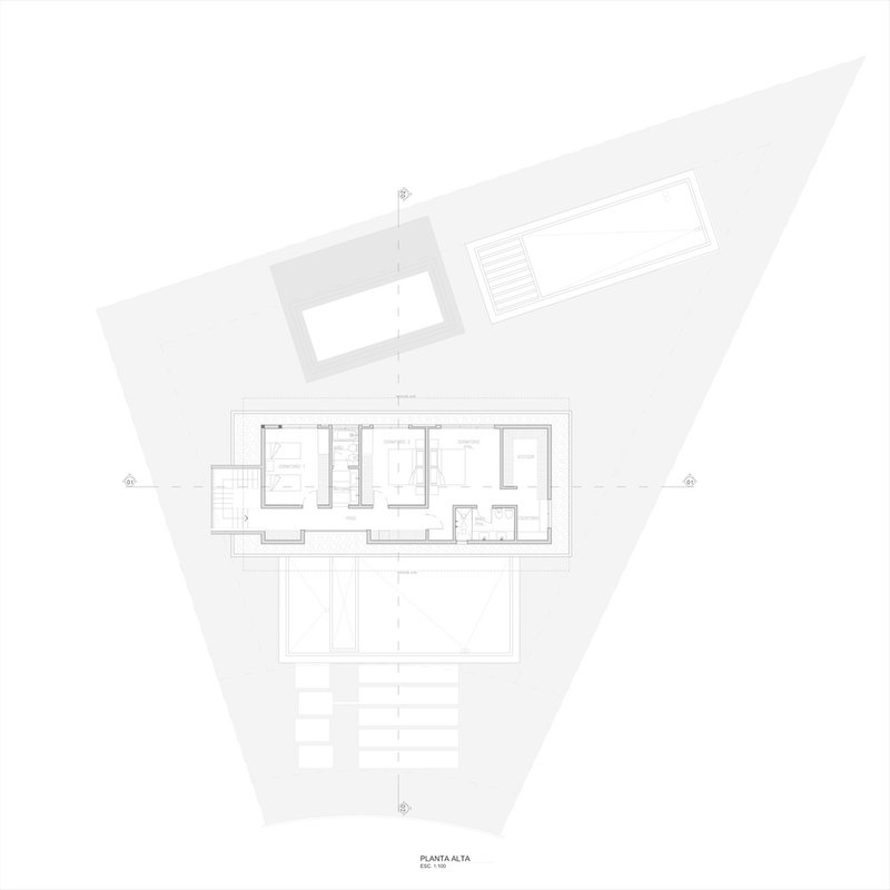 Upper level floor plan drawing showing bedroom layout and central bathroom with triangular site boundary