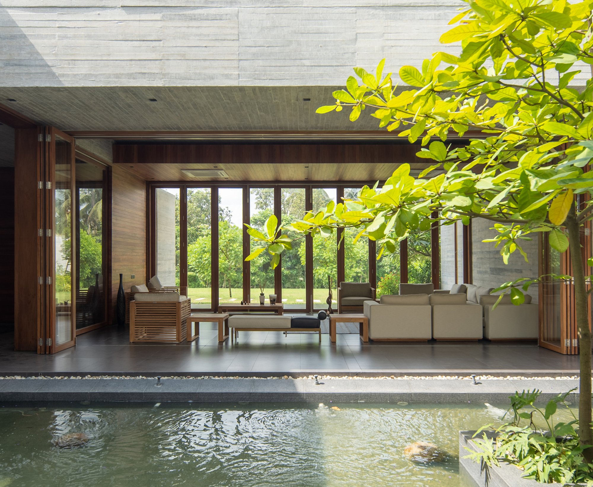 SYSTEM Architects and EKNC Build a Concrete Retreat Around Memory and Water in Bangladesh