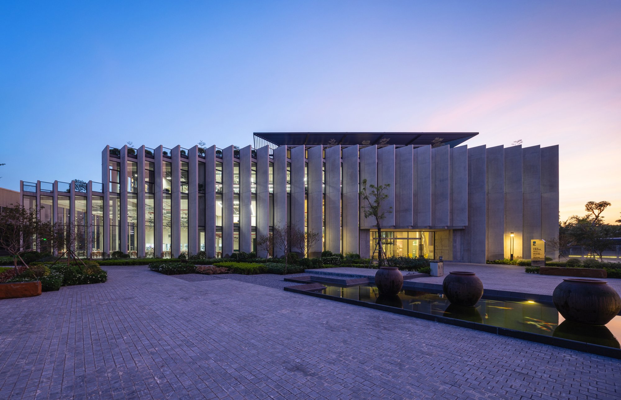 Baumschlager Eberle Wraps a Vietnamese Lock Factory in a Climate-Tuned Concrete Veil