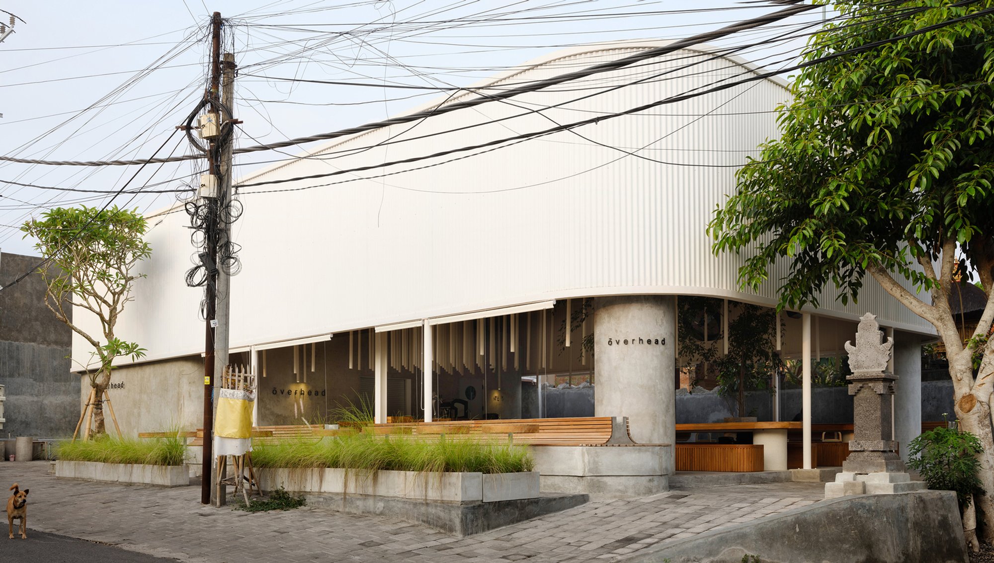 Max Tsybin and Greywoods.pro Slip a Minimalist Restaurant Beneath a Corrugated Canopy in Bali