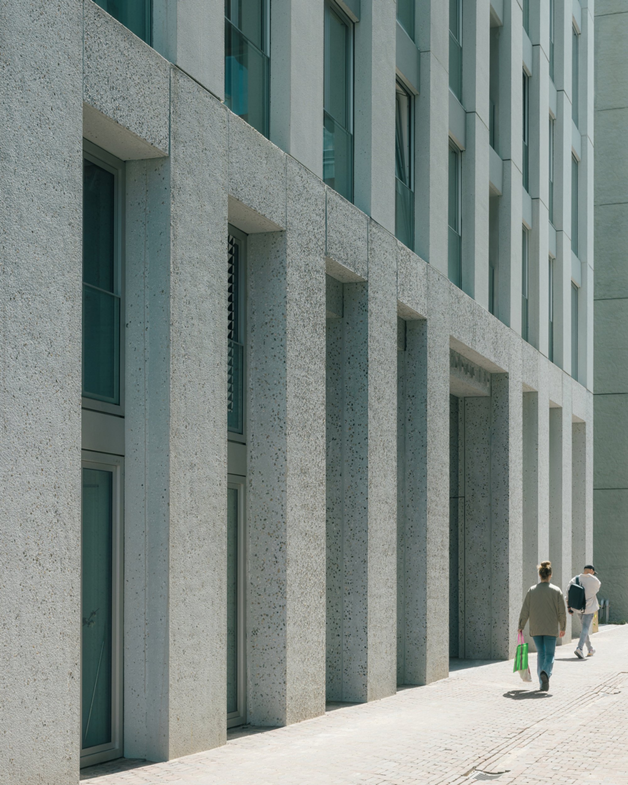 BETA Stacks 95 Apartments and Three Communal Lounges into a Concrete Tower on Amsterdam's Last Shipyard