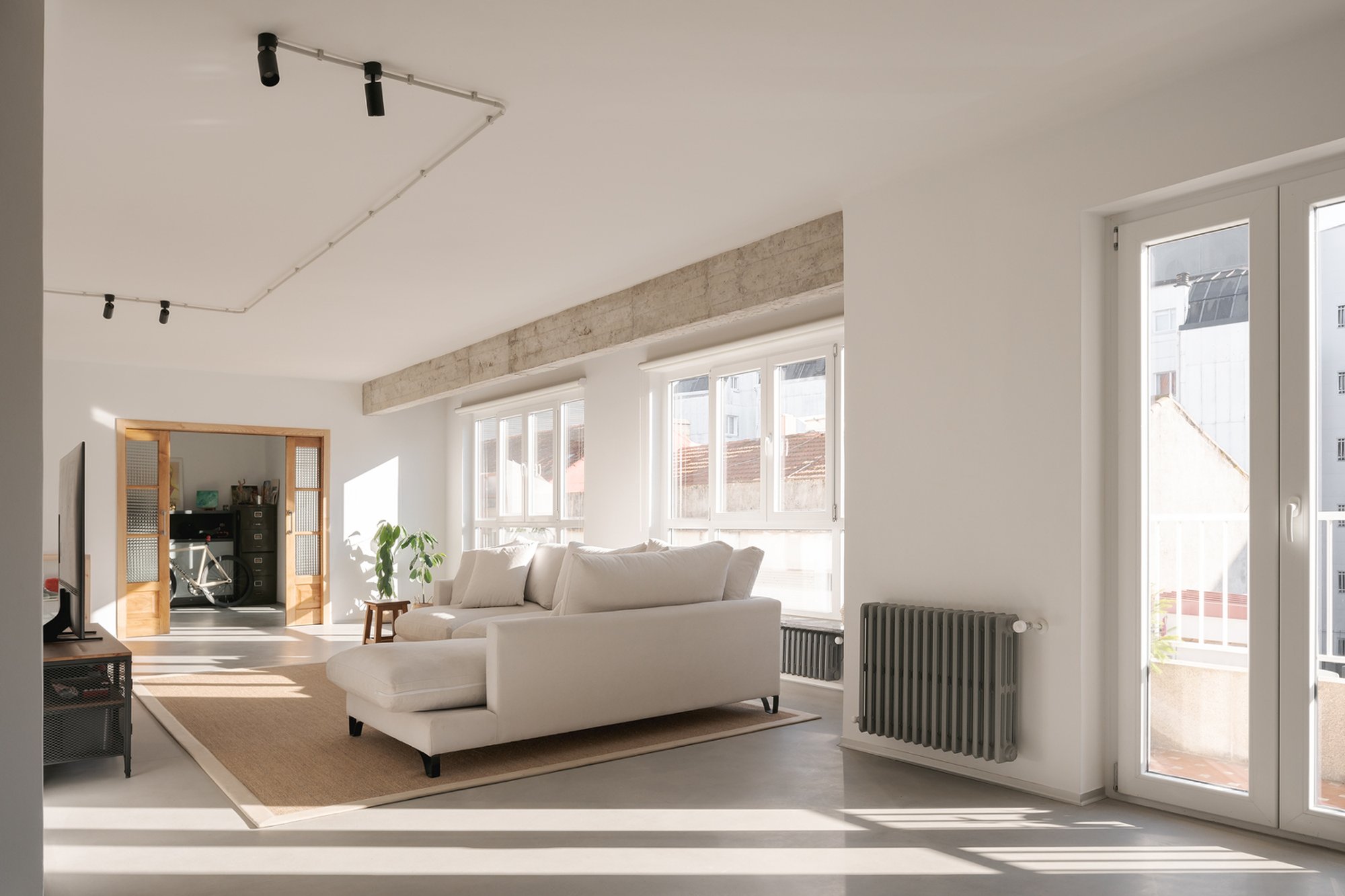 NAN Arquitectos Reveals Hidden Concrete Bones in a Pontevedra Apartment for a Young Family