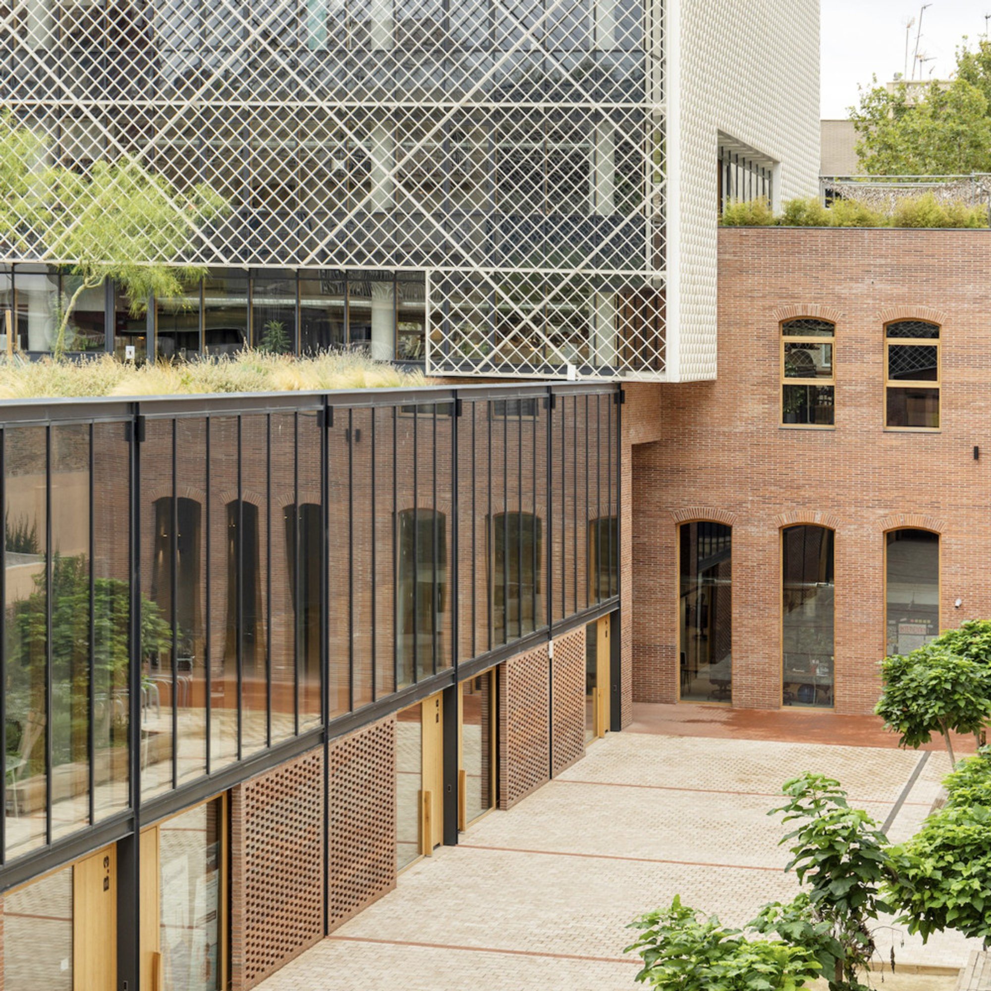 b720 Fermín Vázquez Arquitectos Wraps a Barcelona Jute Factory's Memory in Aluminum Lattice