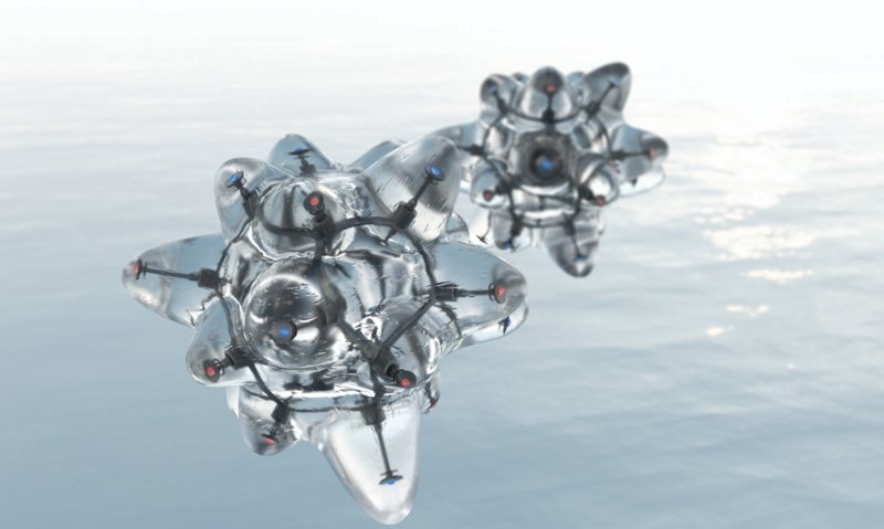 Two metallic silver modules floating above calm water with cloudy sky in the background