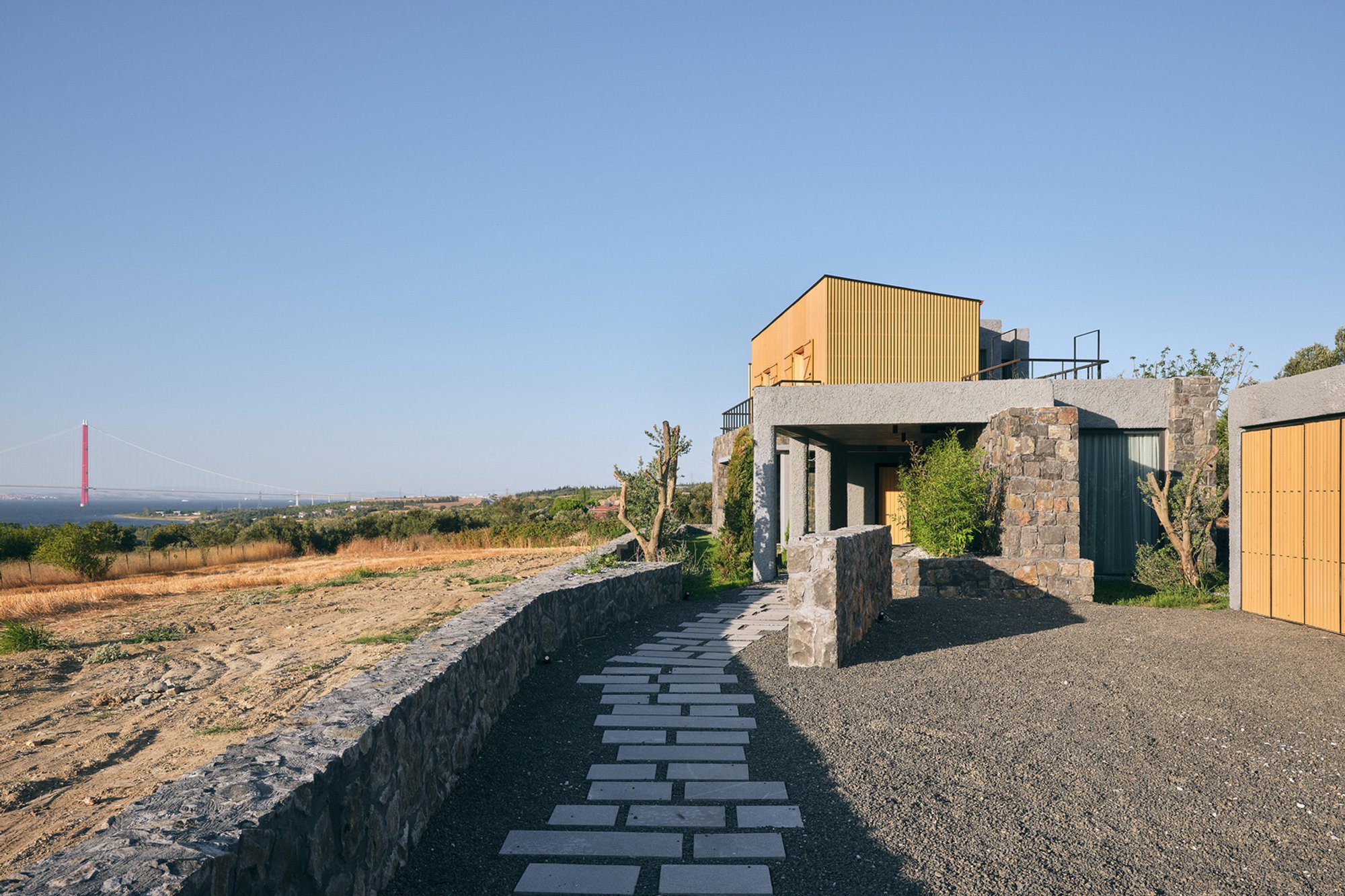 Yalin Architectural Design Builds a Stone-and-Timber House 500 Meters from the Dardanelles Strait