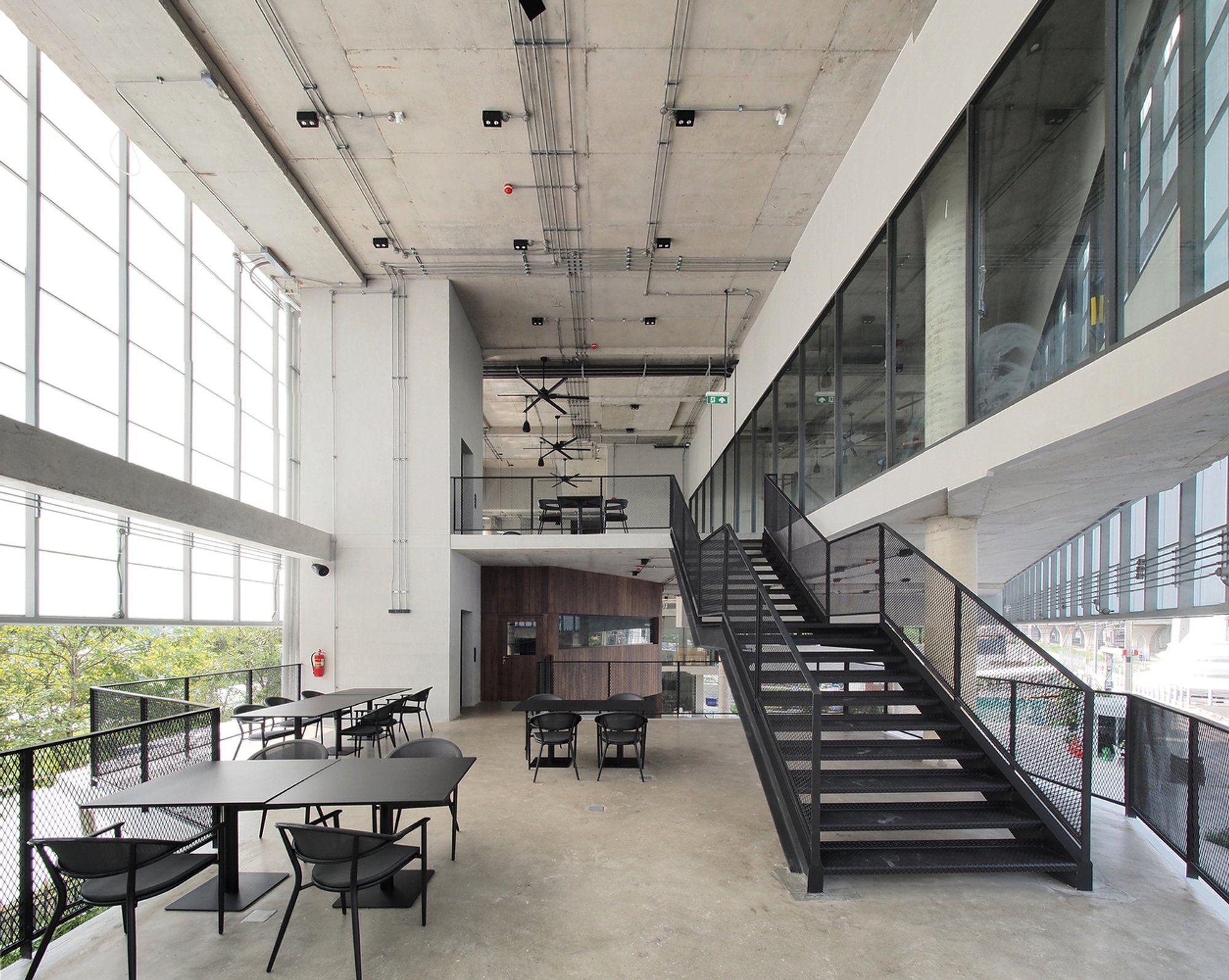 ASWA Wraps a Triangular Mixed-Use Building in Glowing Fiberglass Along the Chaophraya River