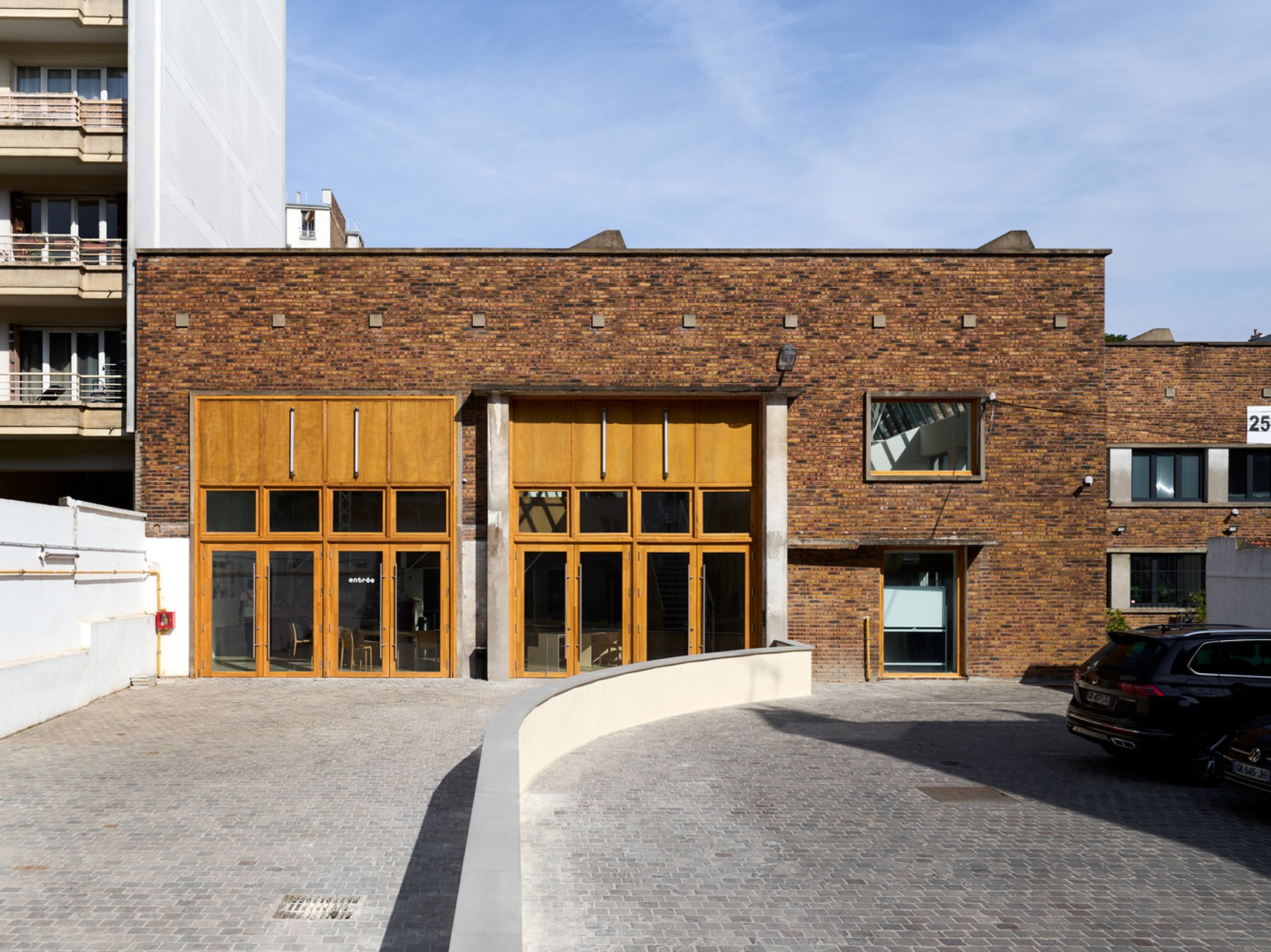 Industrial Building Renovation for Education: Cooking School for Migrants by FREAKS Architecture