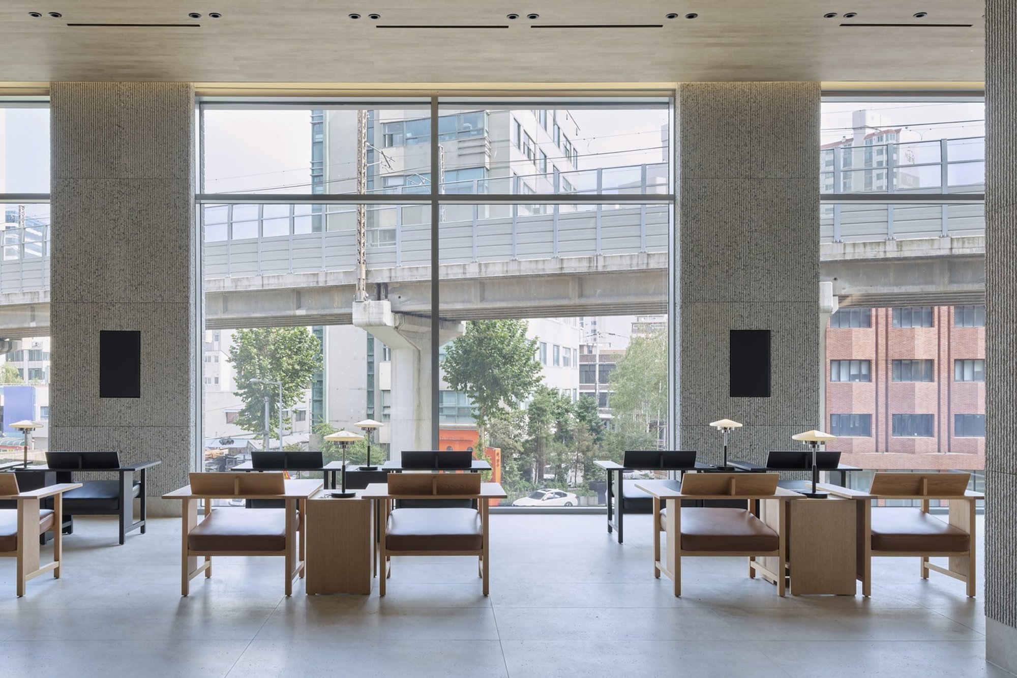 Indiesalon Turns a Seoul Bank Branch into an Urban Shelter Beneath a Floating Parabolic Roof