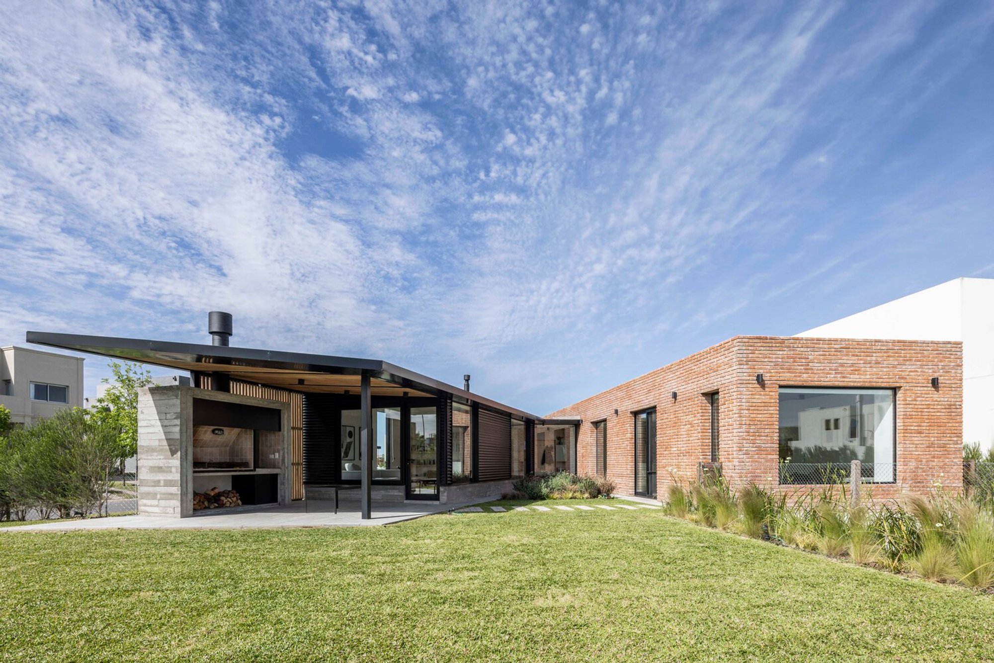 Innovative Corner House Design Argentina: A Case Study of J House by Pirca Arquitectura