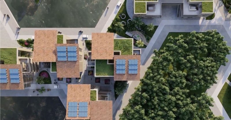 Top view of solar-powered, green-roofed residential buildings.