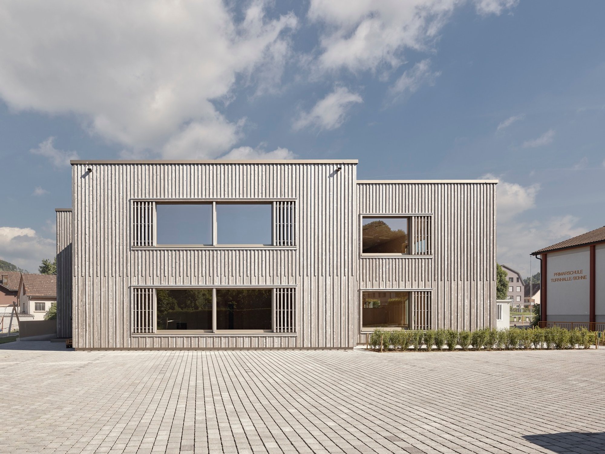 Eco-Friendly School Architecture: The Bütschwil Primary School by Illiz Architektur