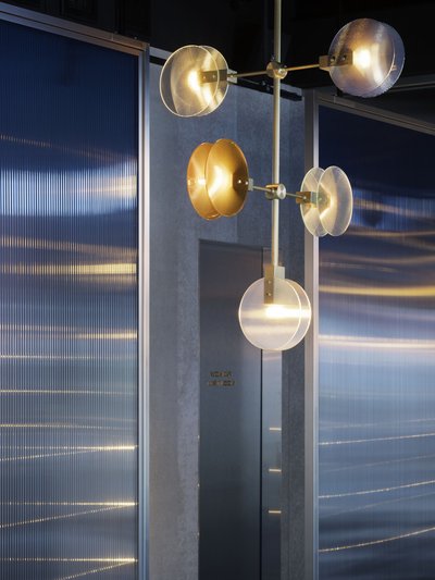 This architectural image showcases a modern interior with a focus on lighting and texture. A strikin