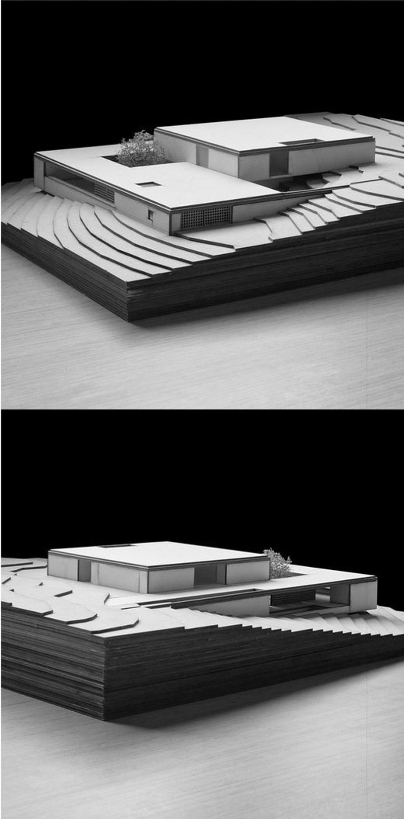 Architectural model showcasing a modern structure integrated into terraced landscape.