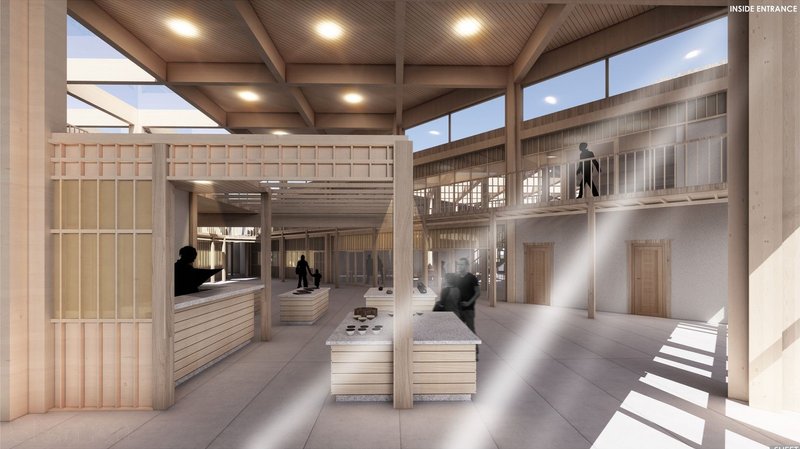 Spacious interior with wooden beams and natural light.