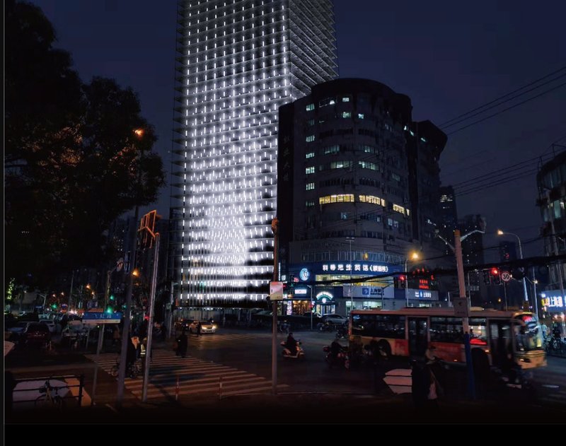 Seen from the street, the tower stands as a quiet sentinel of time and memory, integrating death into the everyday fabric of the city.