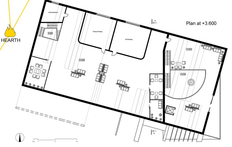 Second level layout with group and art therapy rooms organized around the symbolic hearth centerpiece.