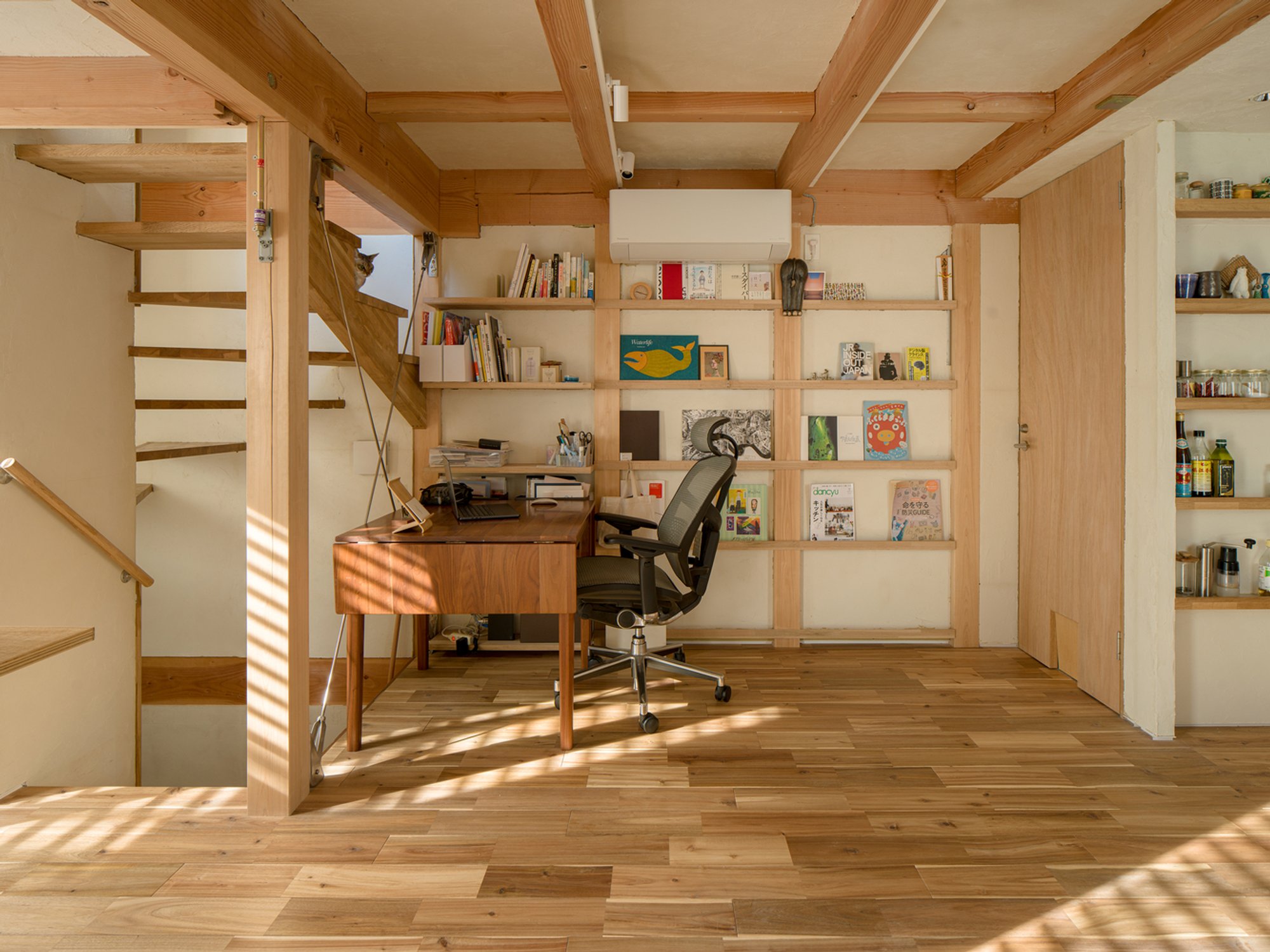 Small Corner Lot House Design: A Vertical Wooden Home by KOMINORU Design