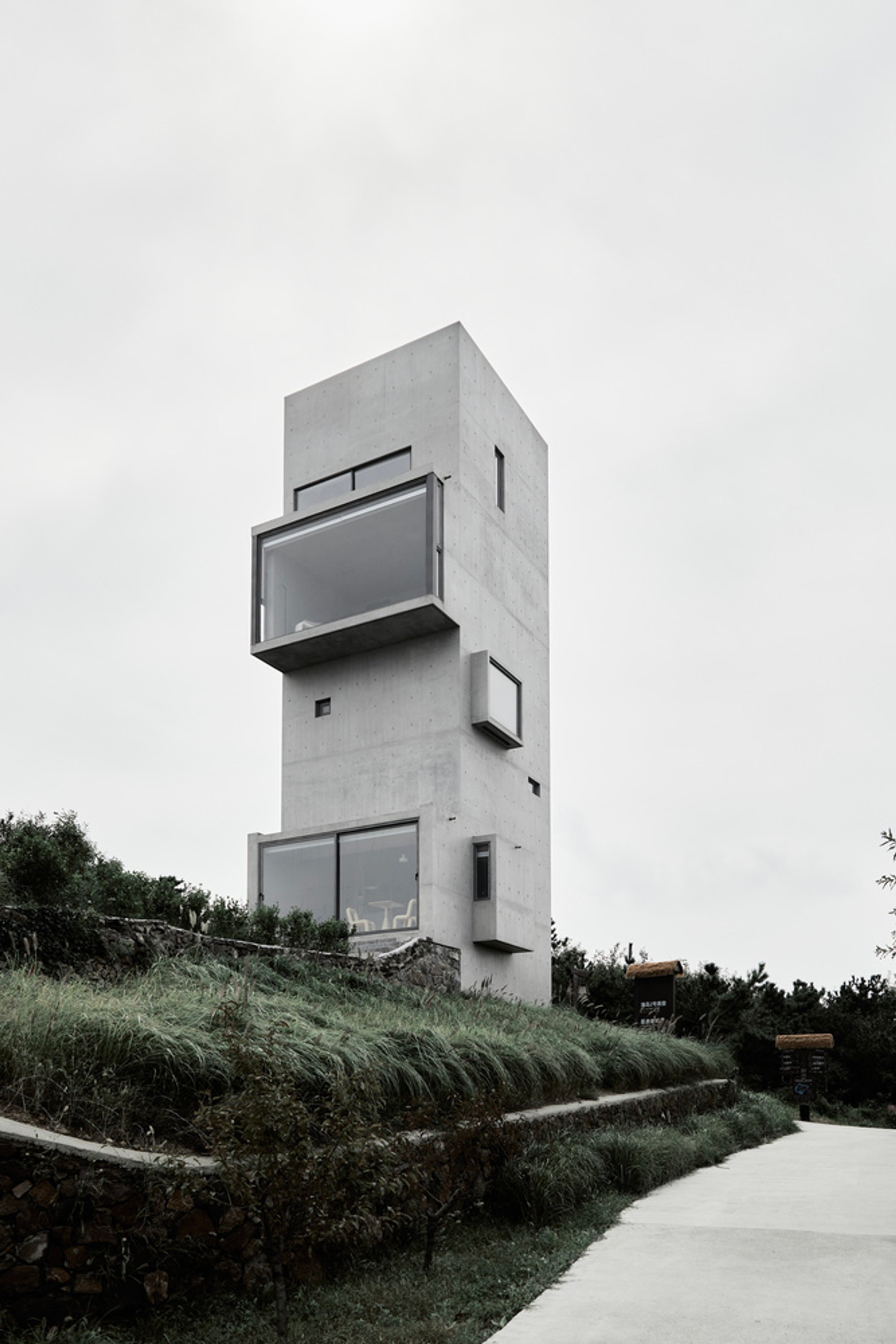 Cliff Café and Tower House by TAO: A Monolithic Retreat at the Edge of the Sea
