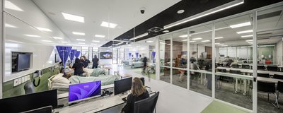 This architectural image showcases a modern hospital simulation lab, designed for healthcare educati