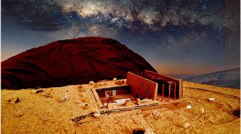 Under starlit skies, the retreat glows—framing a celestial experience within the desert.