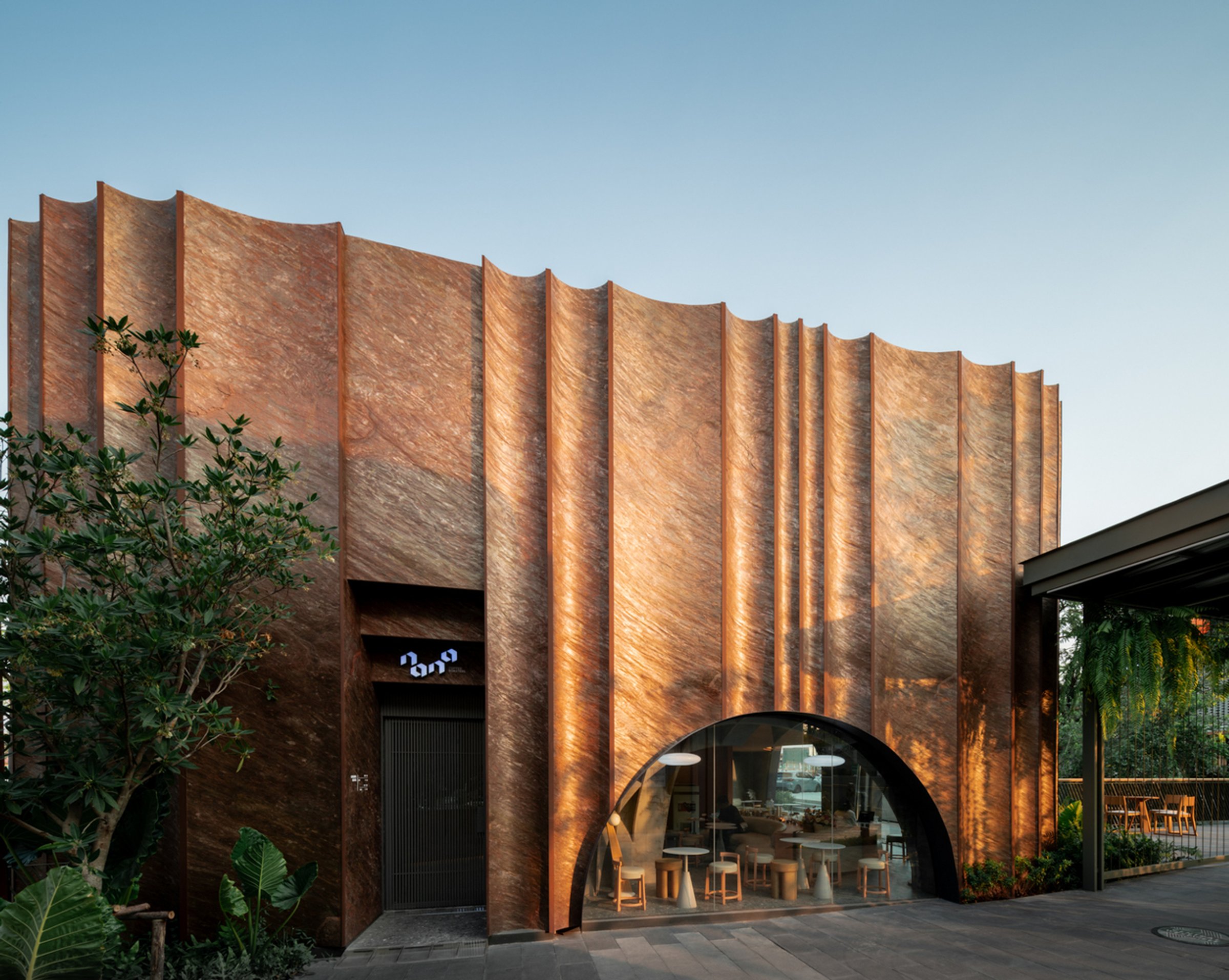 Nana Coffee Roasters: A Cave-Inspired Coffee Shop Architecture by IDIN Architects