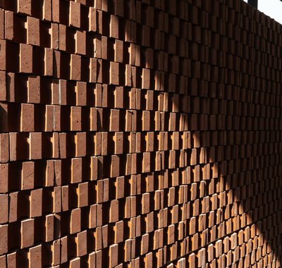 The image showcases a brick wall with a distinctive pattern created by the arrangement of the bricks