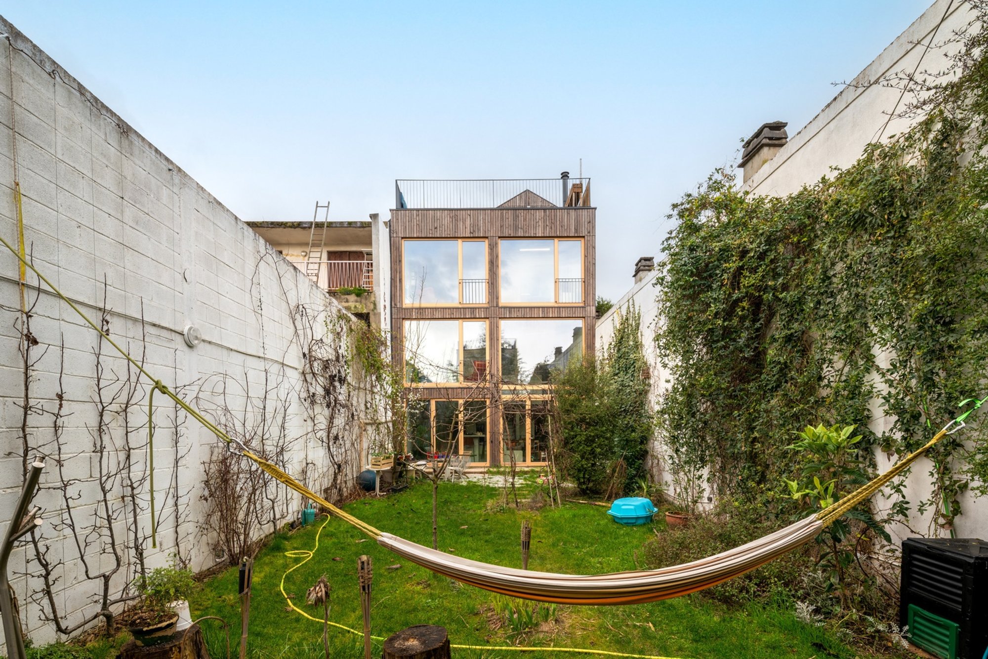 Wood-Concrete House Design: A Contemporary Transformation by MANO