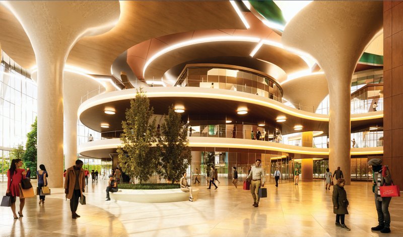 A vibrant multi-level atrium welcomes visitors with organic forms and natural light at the core of the retail zone.