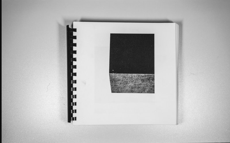 Stark black monolith print, capturing the presence of oppressive urban materiality.