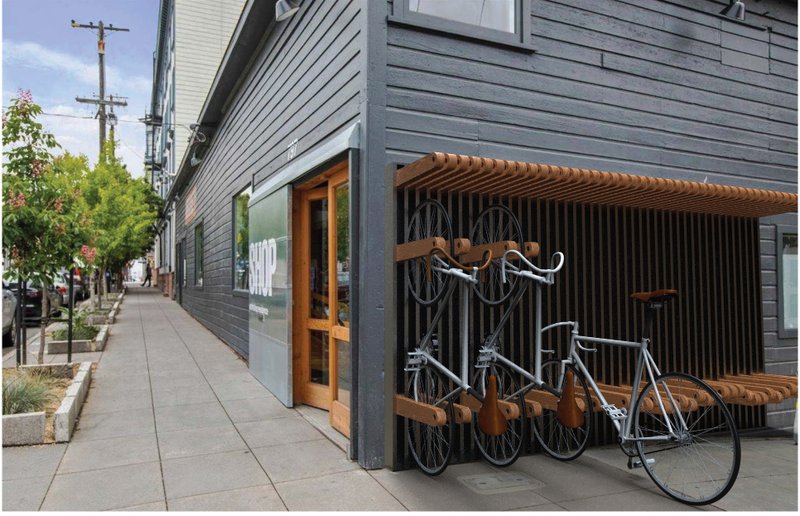 Integrated racks support active commuting by offering secure, accessible parking for urban cyclists.