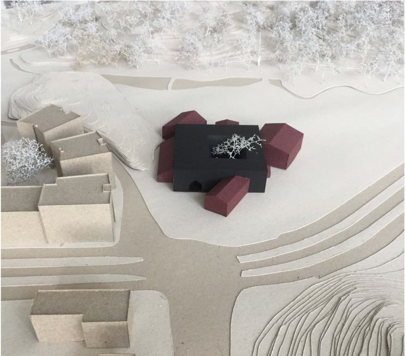 Site model reveals integration with natural surroundings and urban context.