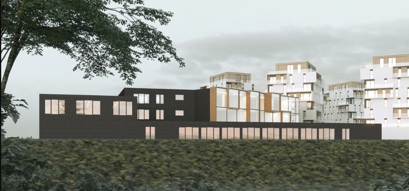 The school seamlessly integrates with the surrounding residential architecture, emphasizing unity and openness.