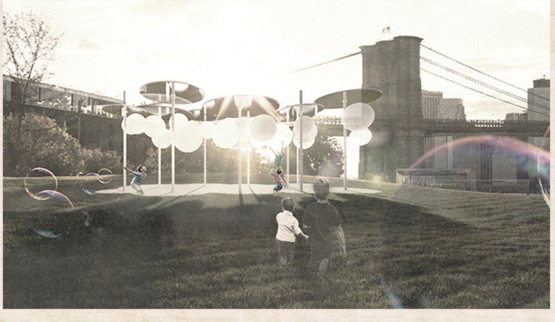 Children interact joyfully with the balloon canopy in a public park, reanimating the space with wonder and light.