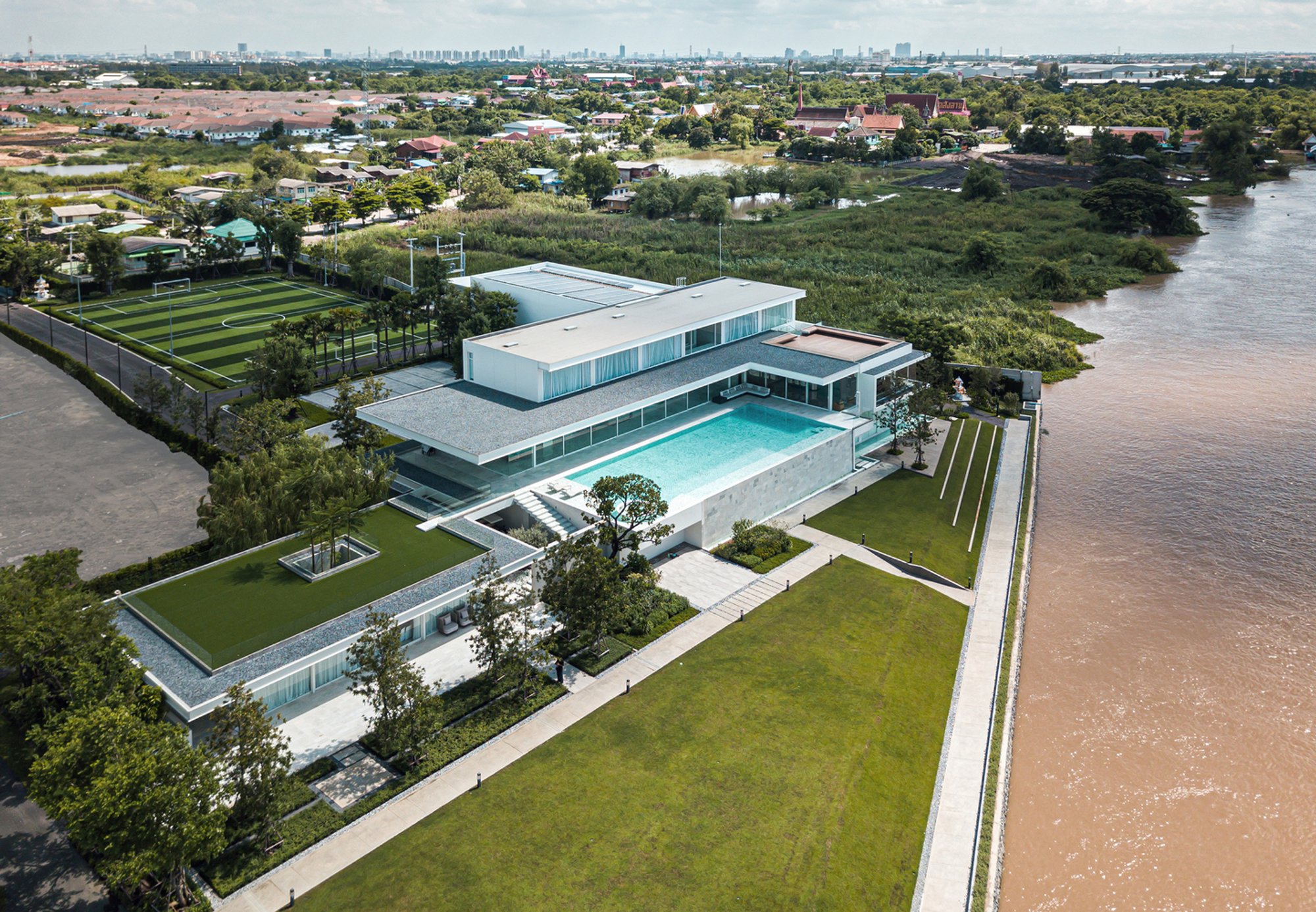 River House by OfficeAT: A Panoramic Riverside Retreat for Multi-Generational Living and Leisure in Thailand