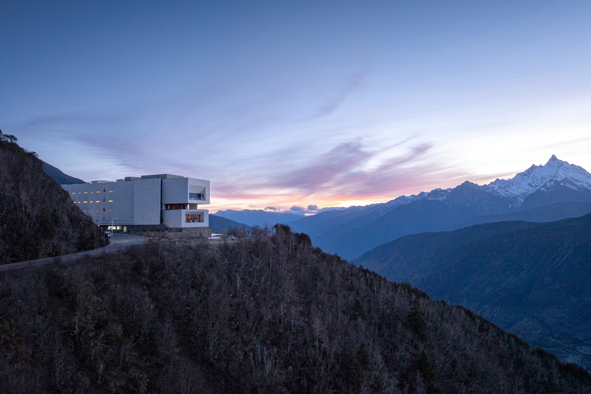 Mountain Hotel Architecture in Tibet: Poodom Deqin Meri Hotel by BUZZ by Büro Ziyu Zhuang