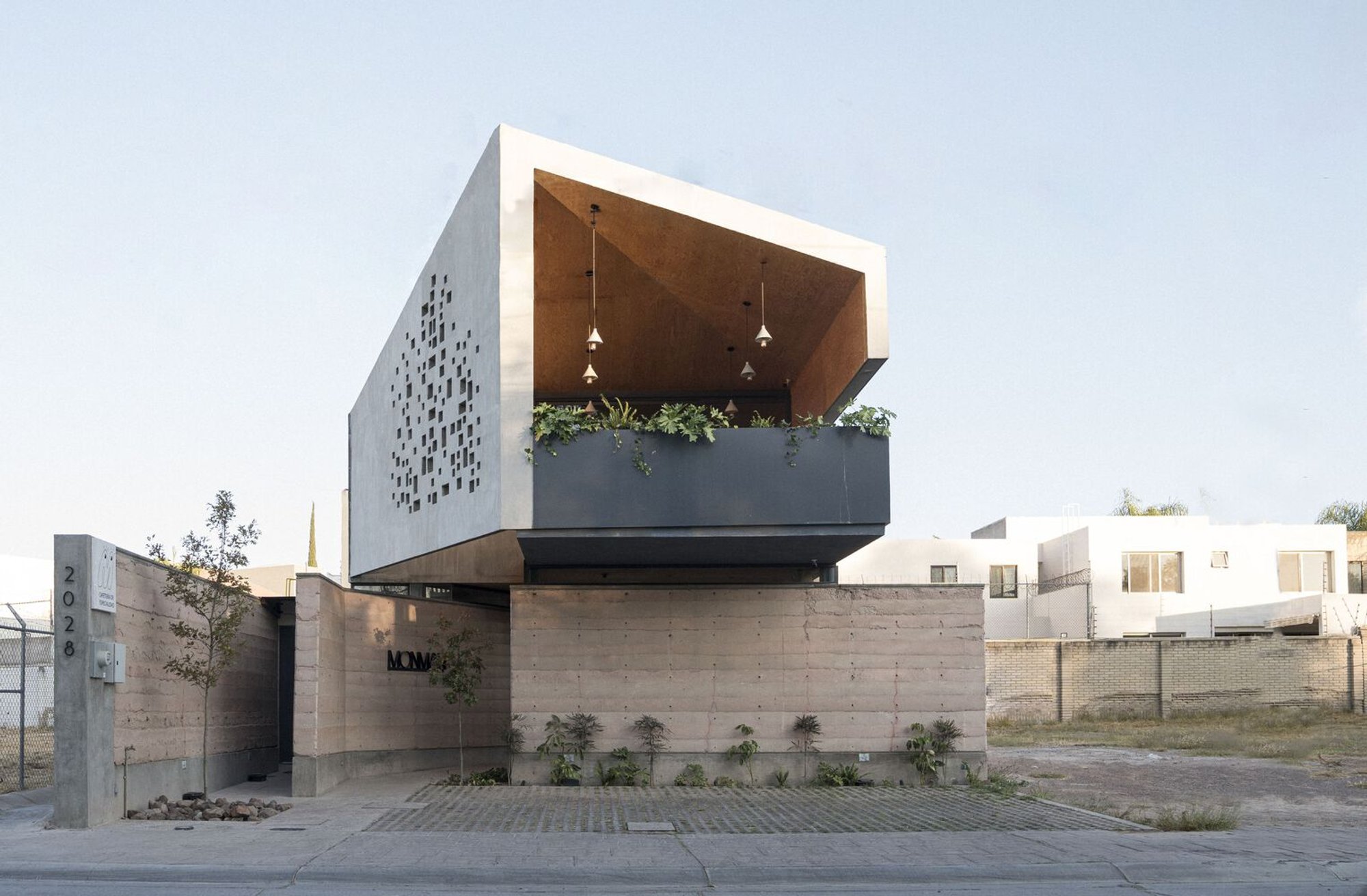 Monman Café by LM Arkylab: A Sensory Café Oasis Rooted in Earth and Nature