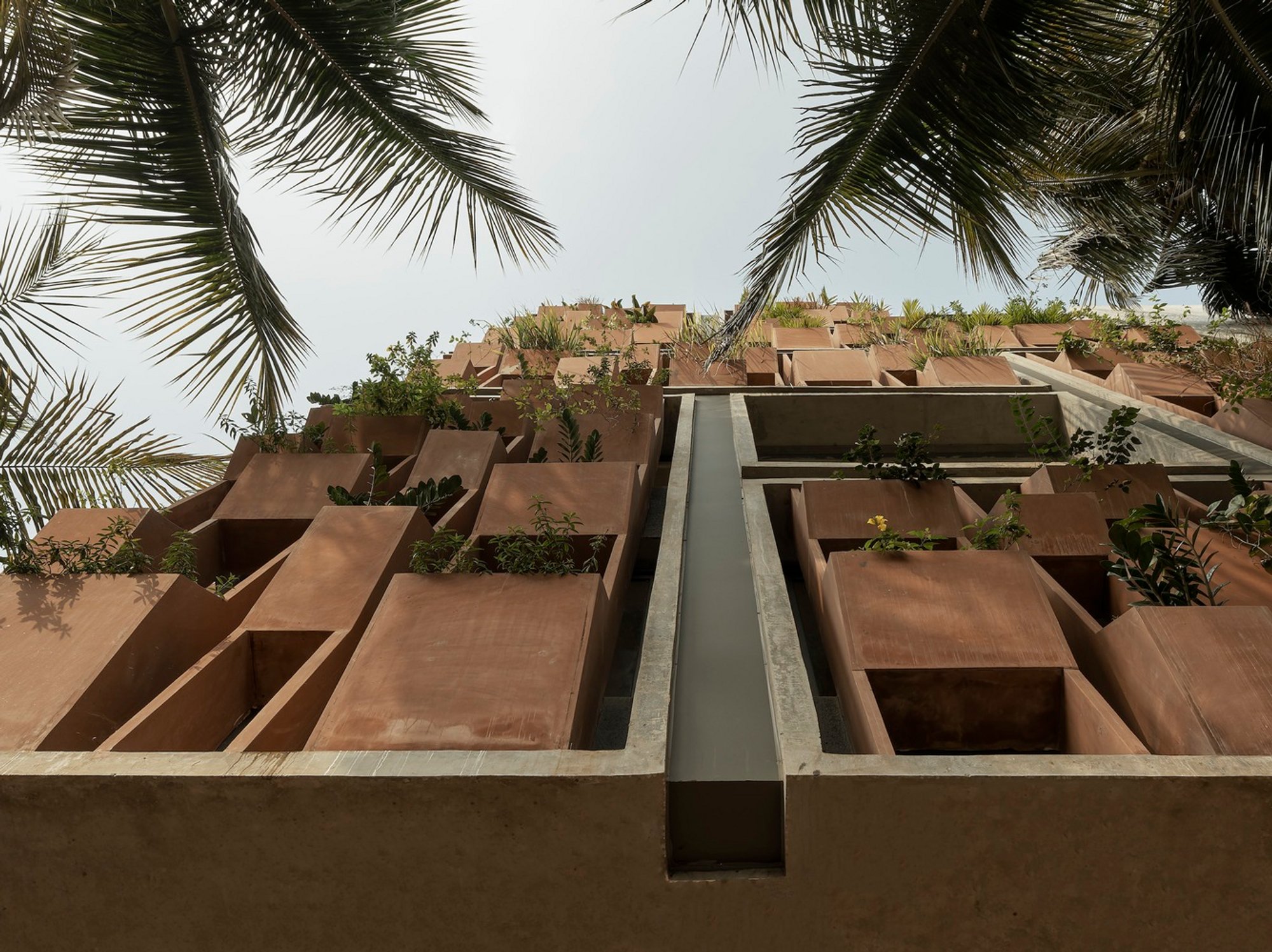 PMA madhushala Wraps a Pune Co-working Space in a Hand-Carved Sandstone Skin That Breathes
