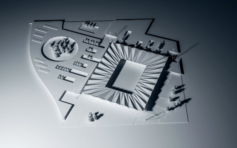 A comprehensive view of site organization, showcasing landscape integration and vehicular approach patterns.