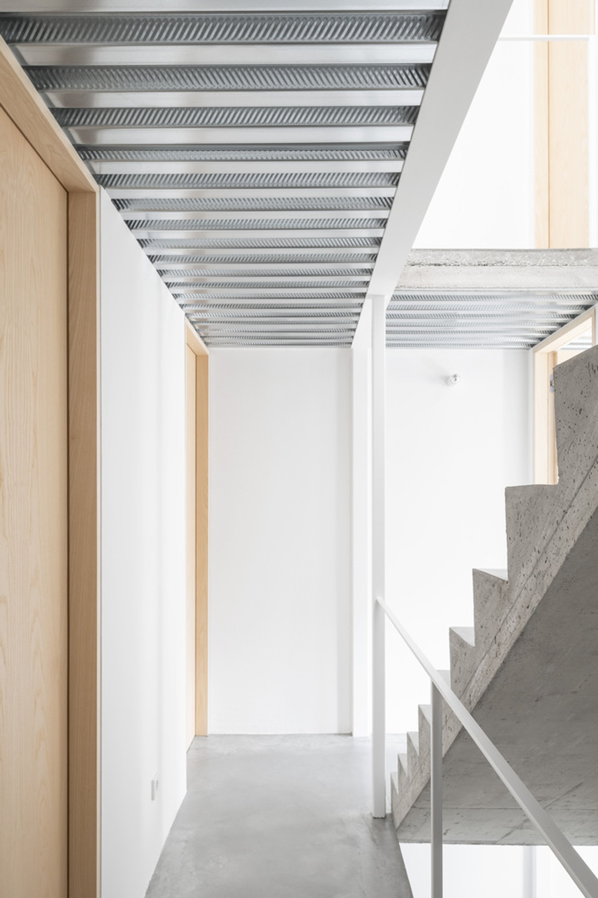 Romano Tinazzi Threads a Steel Skeleton Through a Protected Railway Workers' House in Verona