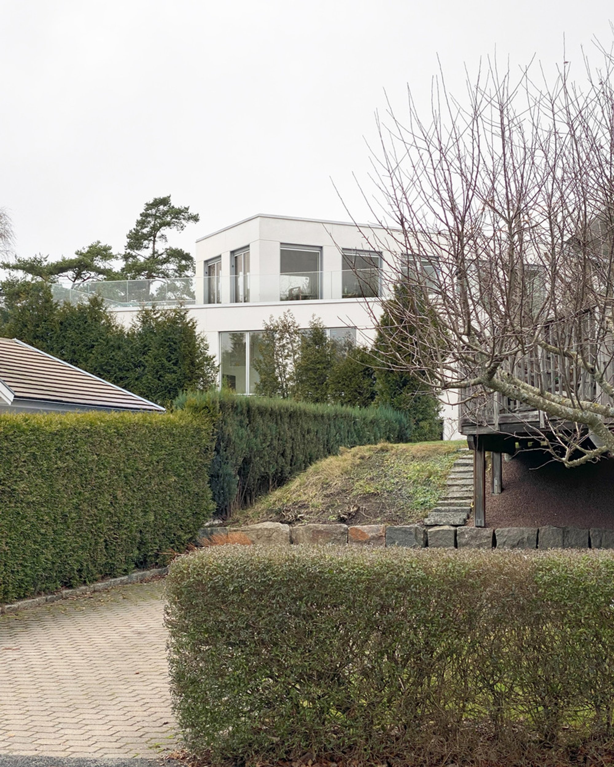 Reppen Vilson Carves Two Rotated Concrete Volumes into a Rocky Gothenburg Hillside