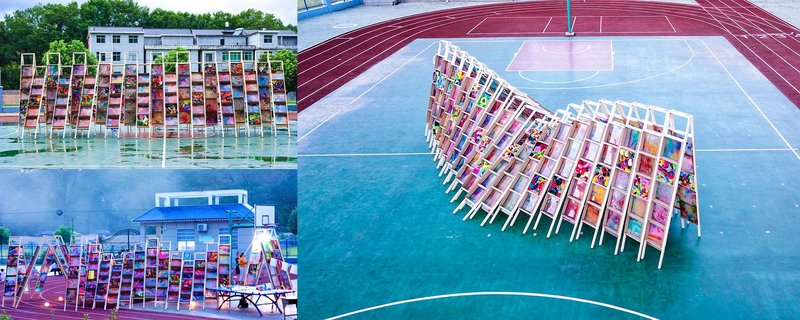 An aerial view of the Hi Ladders High pavilion, showcasing the creative wooden ladders arranged in a dynamic, colorful formation on the playground.