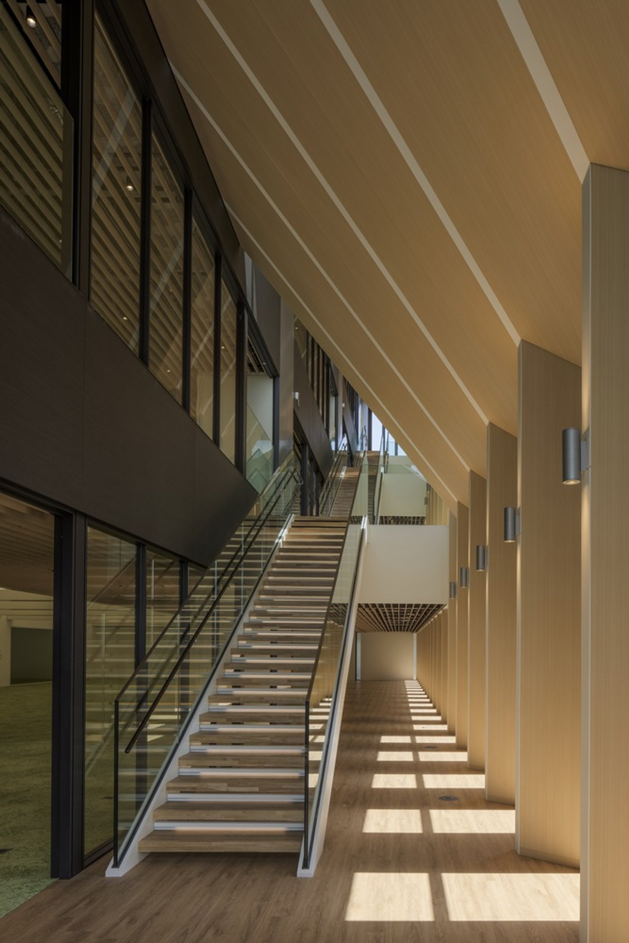 Nikken Sekkei Carves Diagonal Atriums Through a Tokyo Office to Let the Building Breathe