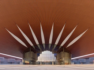 Zaha Hadid Architects Weaves 611,000 Square Meters of Copper Ribbons into Beijing's Largest Convention Center