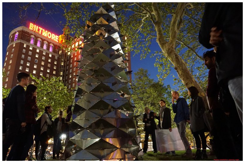 Illuminated Reflections – The Kaleidoscope-Periscope glowing under the city lights at its opening night.